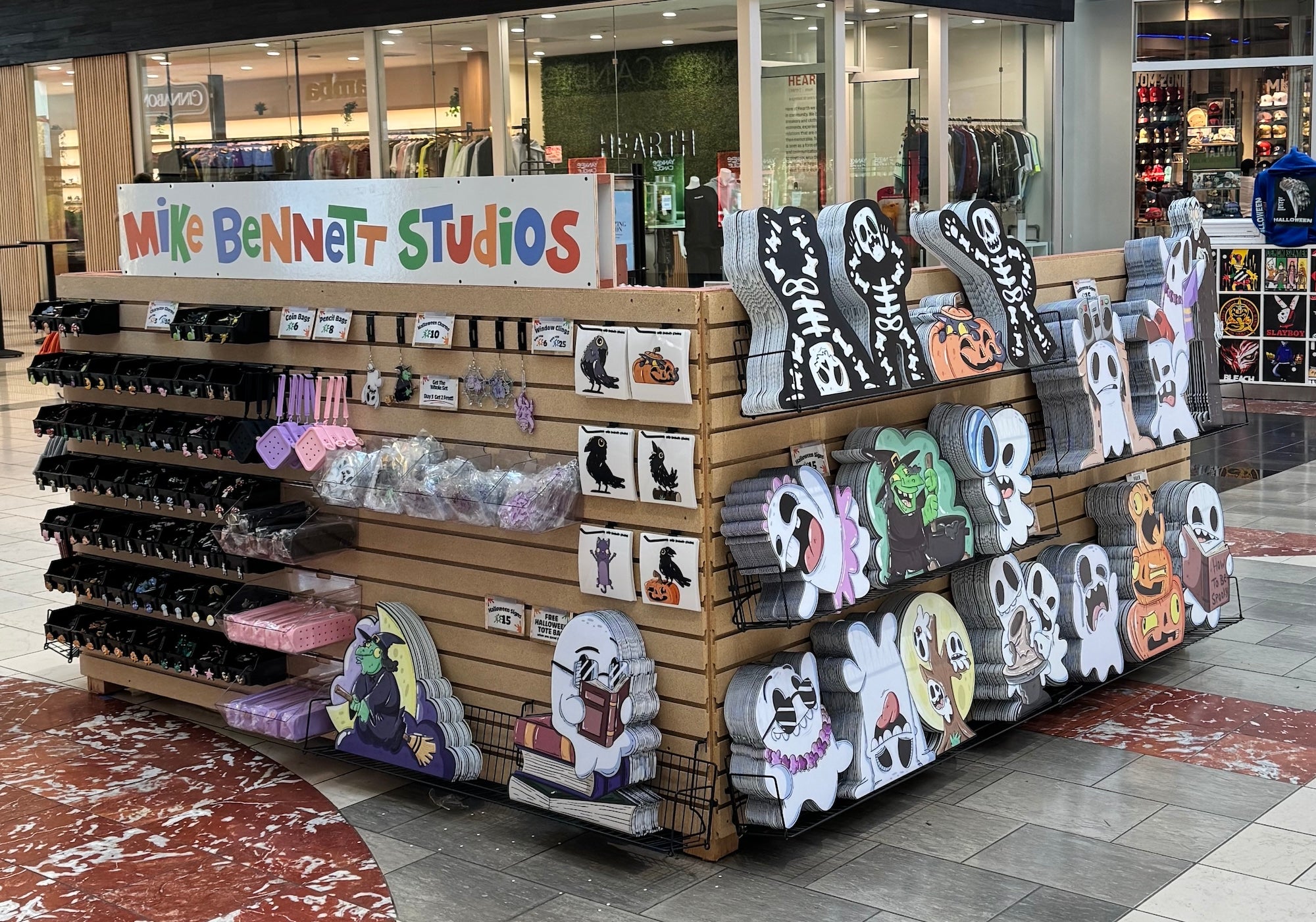 Mall kiosk with ghost and skeleton yard signs